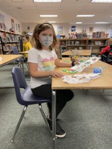 Student creating in makerspace