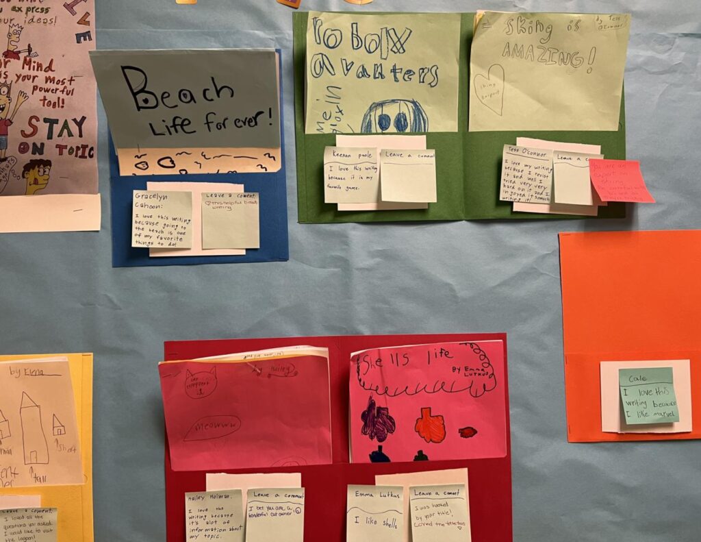 Student writing on bulletin board