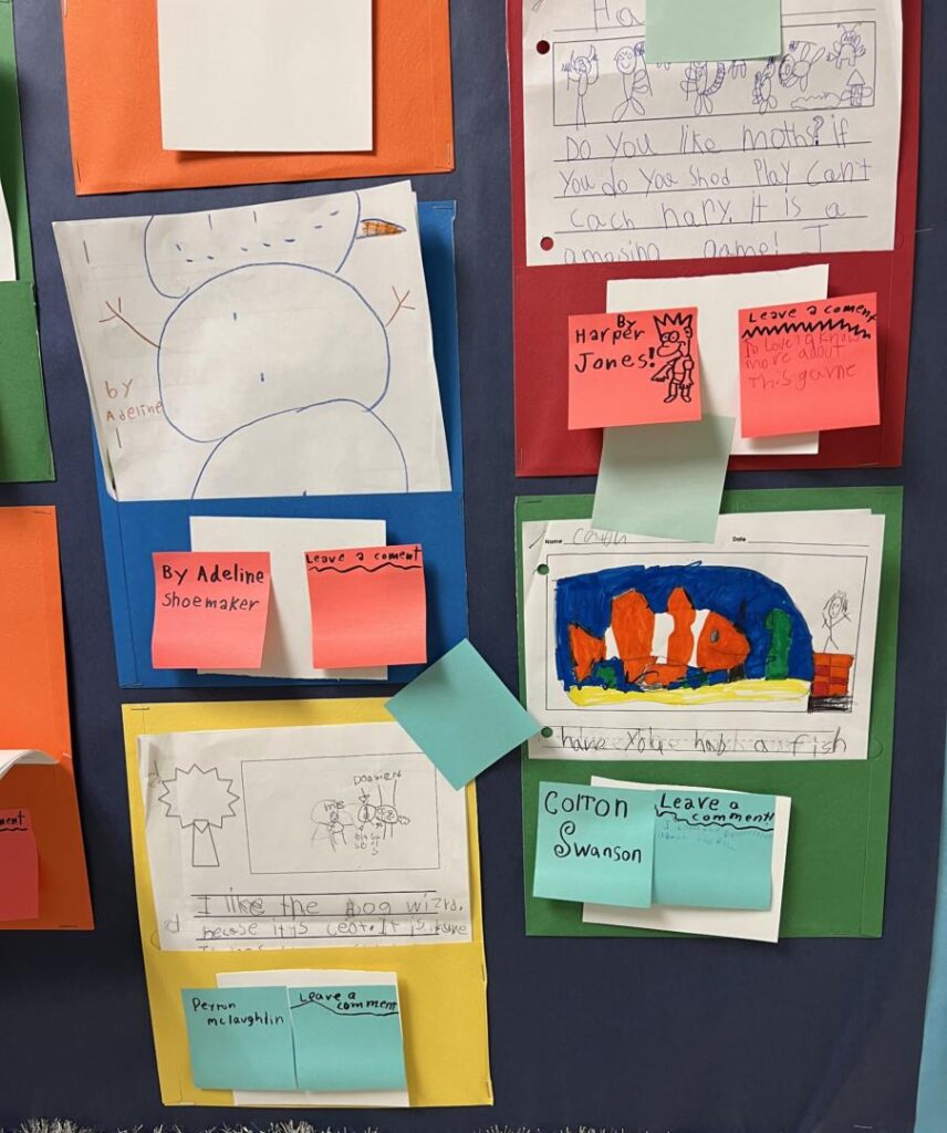 Student writing on bulletin board