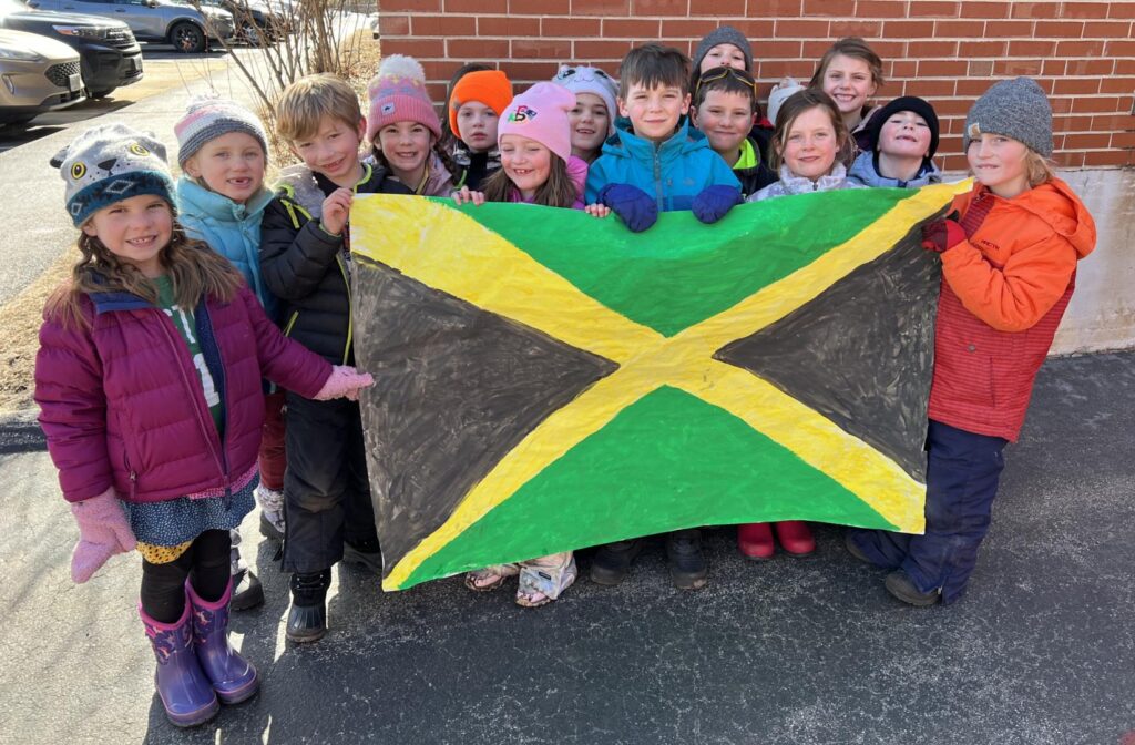 students holding their flag