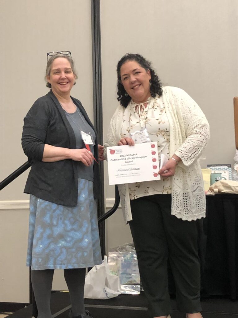 Mrs. Anderson receiving her award for Outstanding Library program 2022