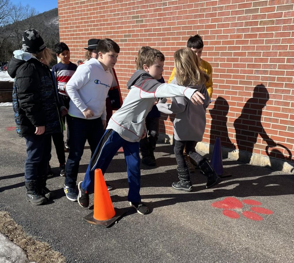 students doing ring toss