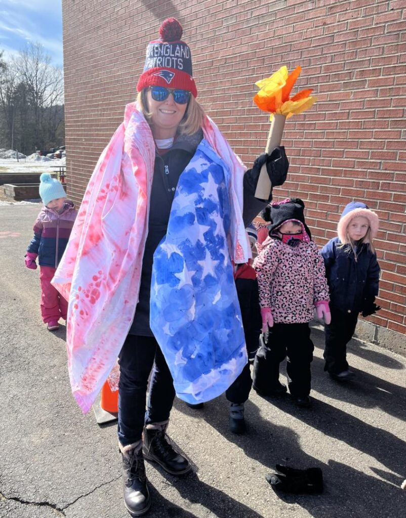 teacher wrapped in their flag