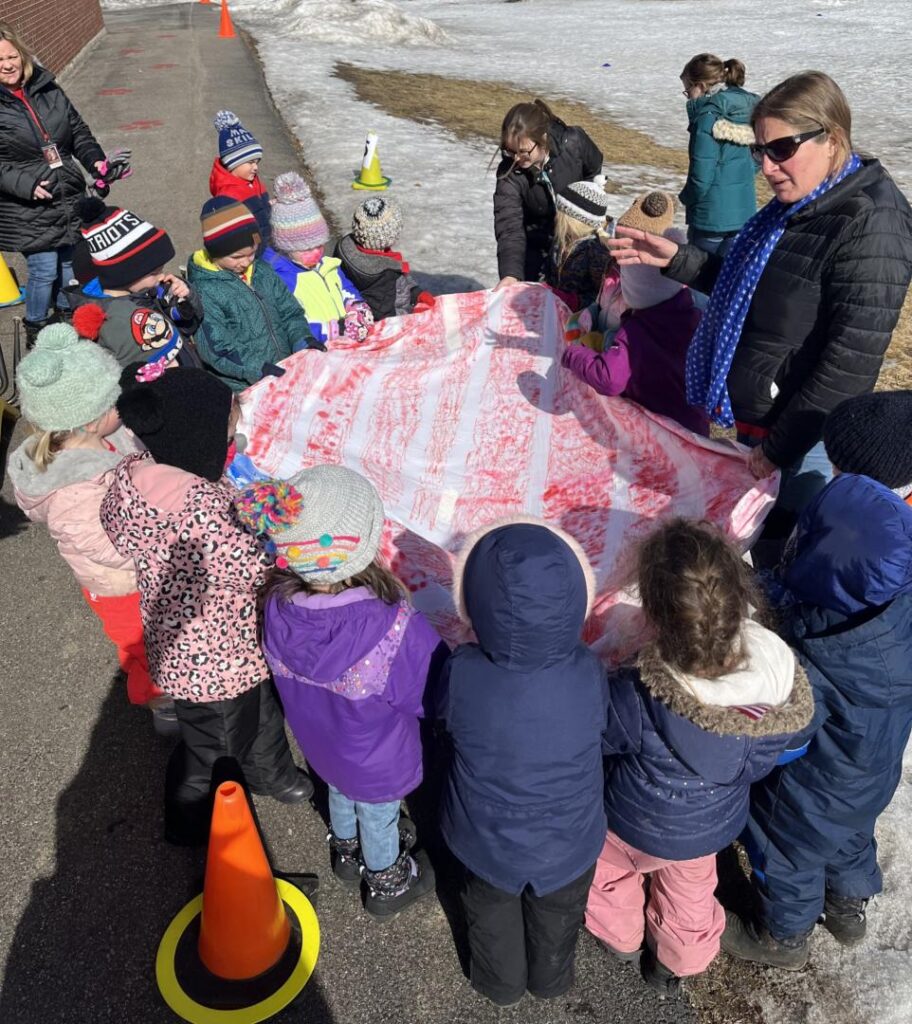 students holding their flag