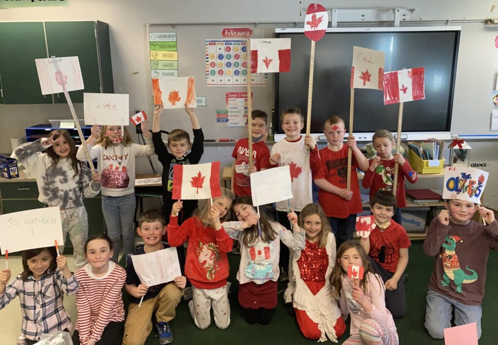 students displaying their flags