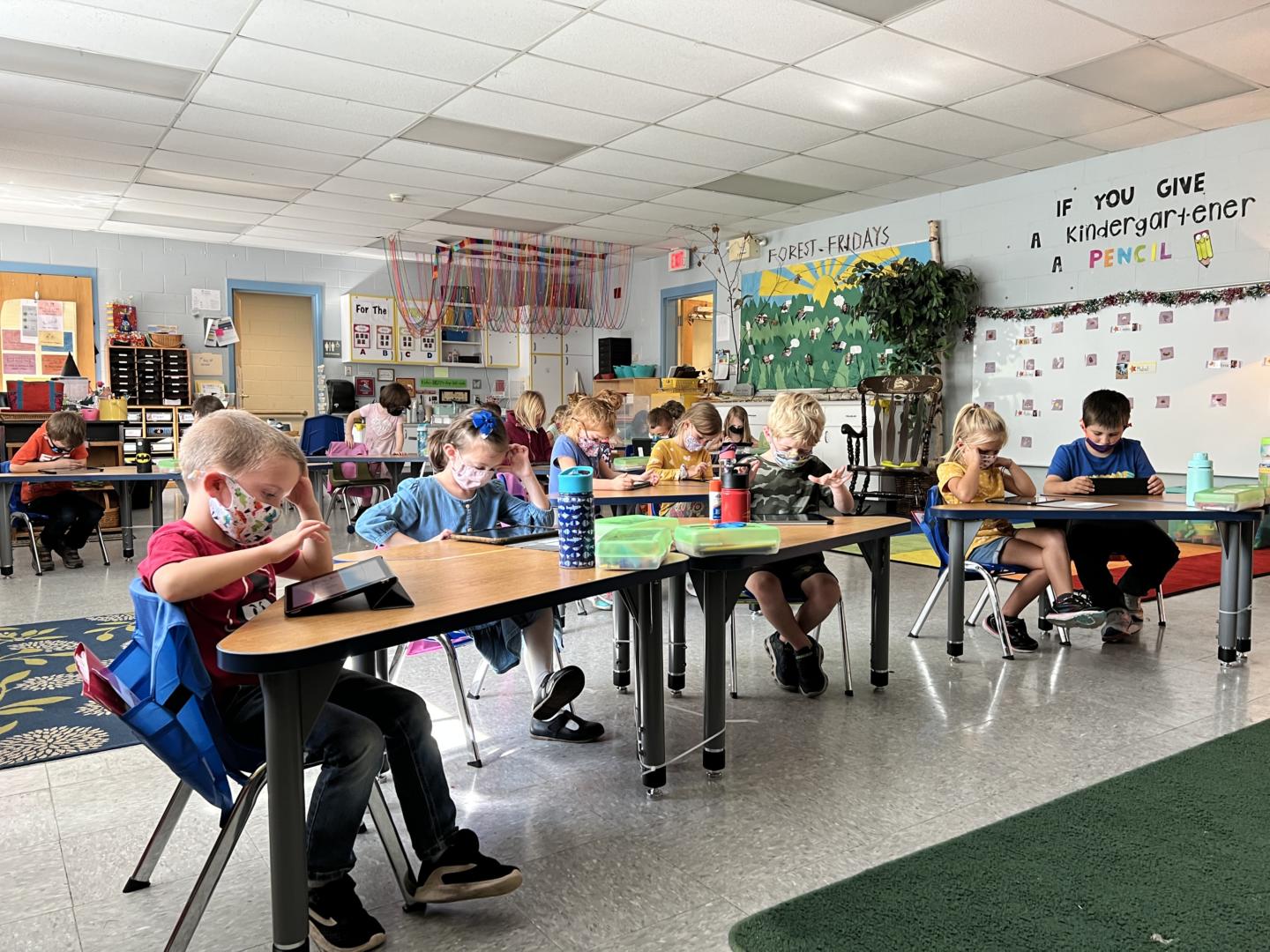 kindergarten students exploring on iPads