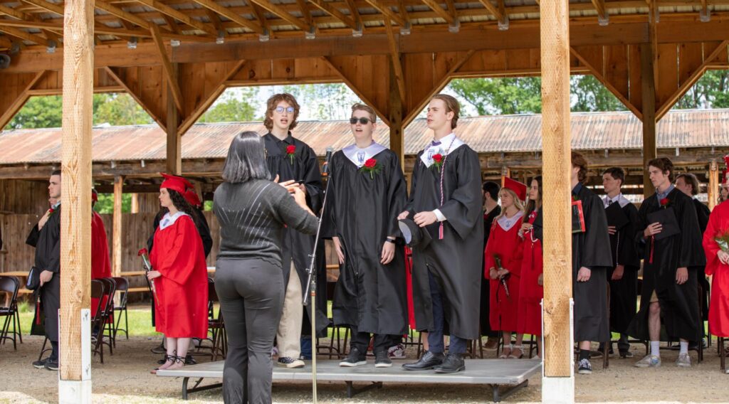 MA Grads Singing National Anthem