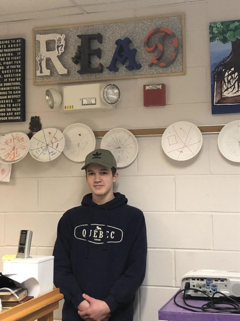 student standing in front of READ sign
