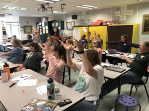 teachers raising hands