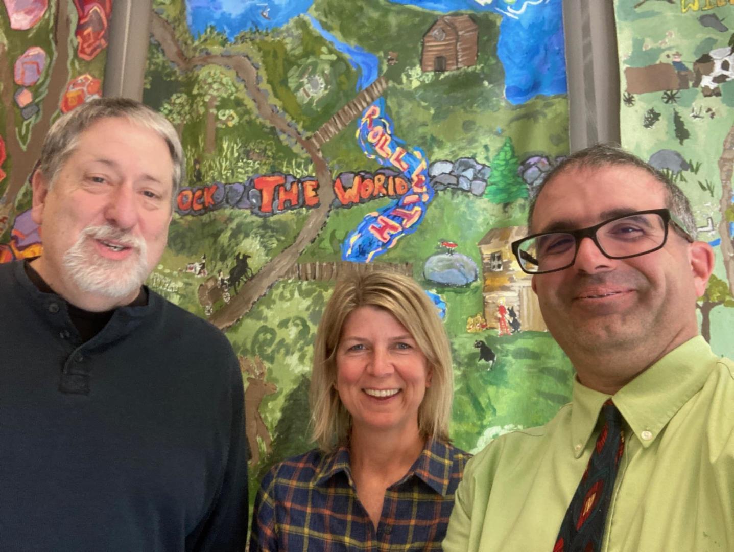 3 adults smiling