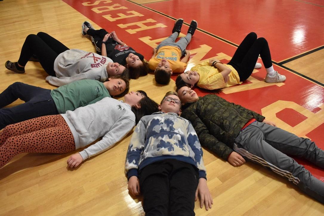 students on gym floor