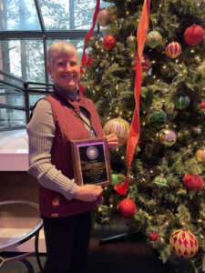 woman smiling with award