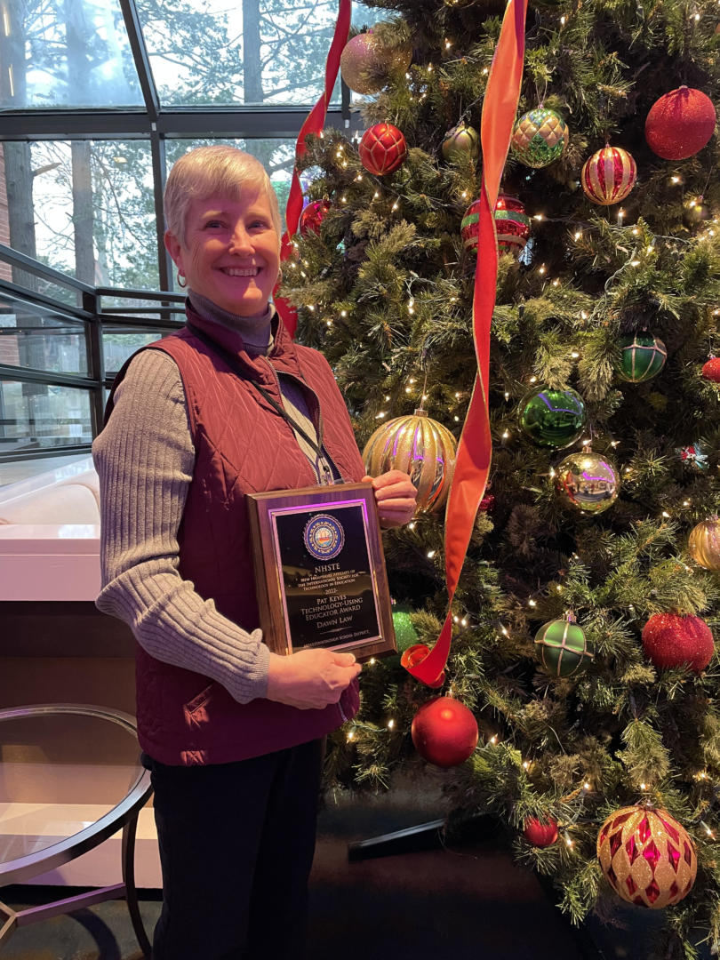 woman smiling with award