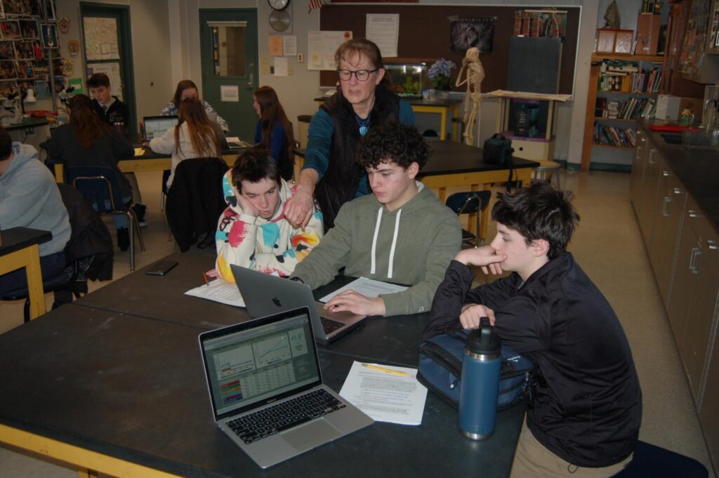 Professor Stave working with students