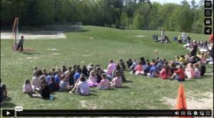 students sitting outside