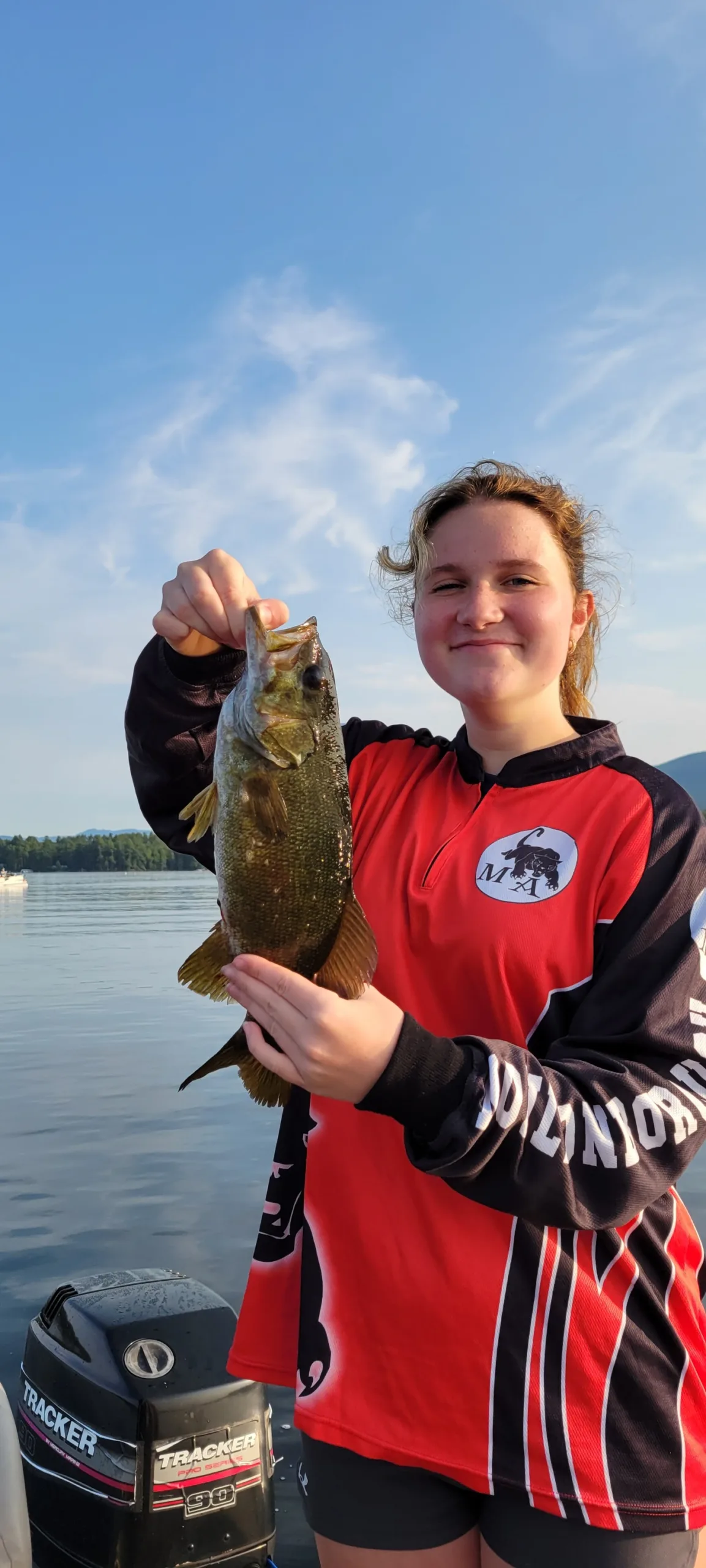 girl holding fish