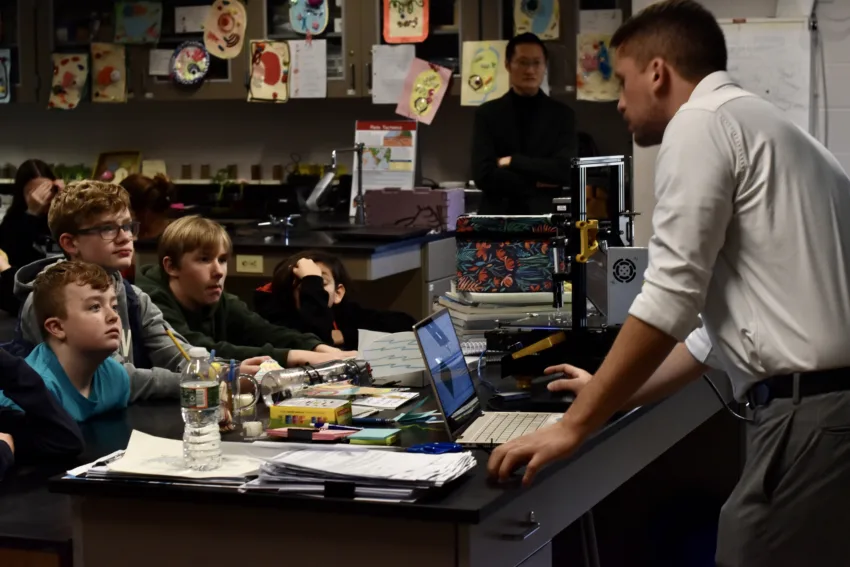 Dr. Carlos Garciamendez-Mijares demonstrates how to use a 3-D printer.