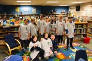 A group of students wearing their reading buddy shirts.