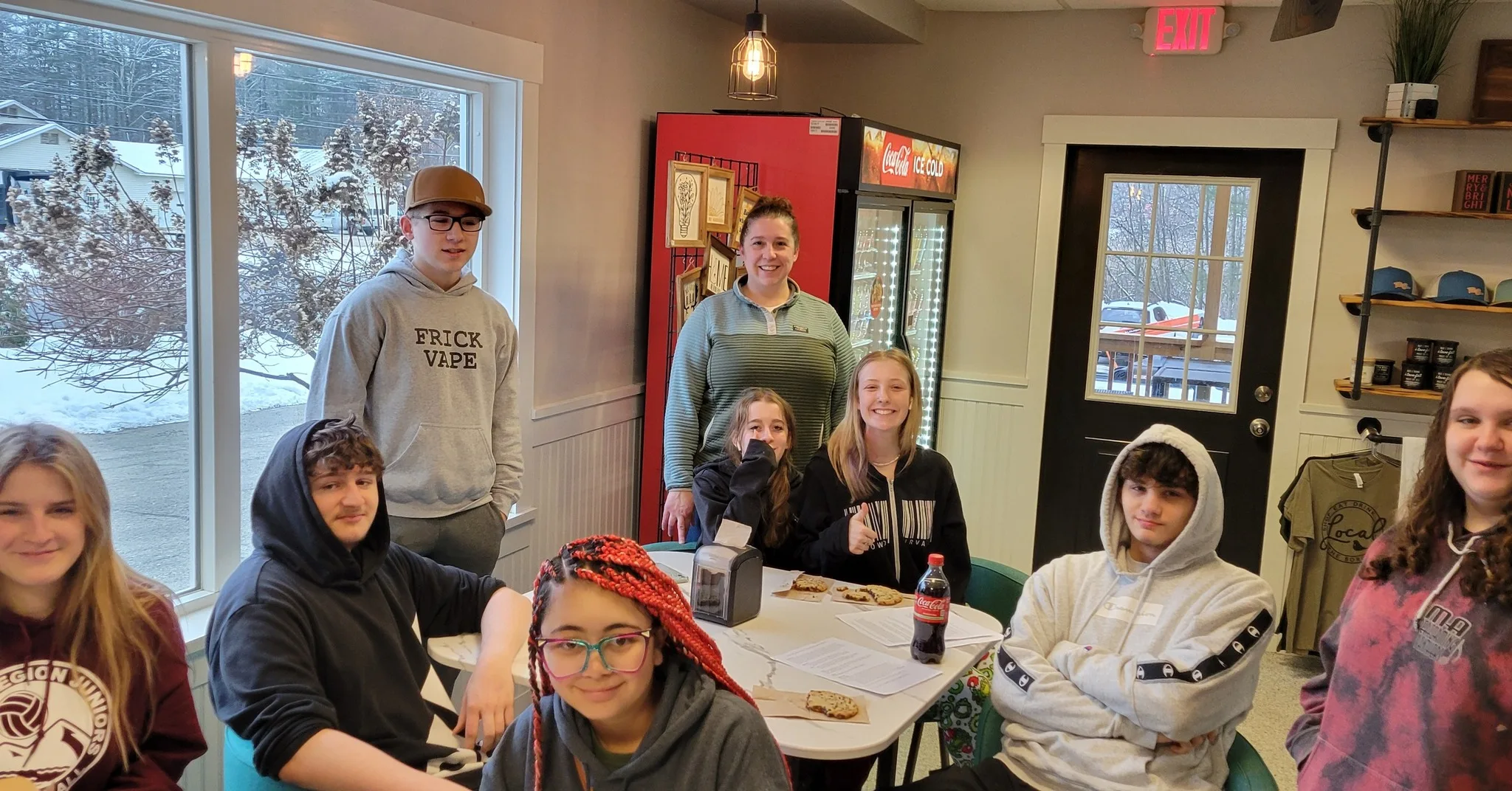 students gathered around a table